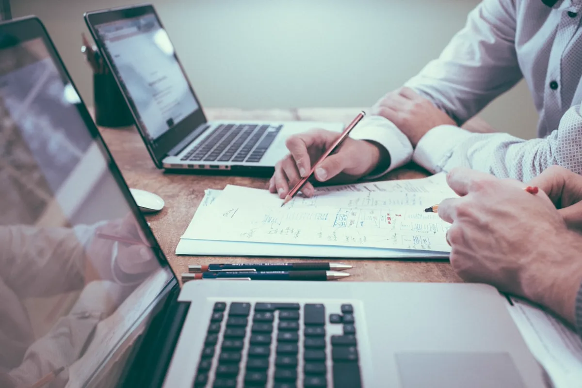 Professional reviewing research data on a laptop